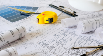 construction workers discussing project plans at a busy worksite